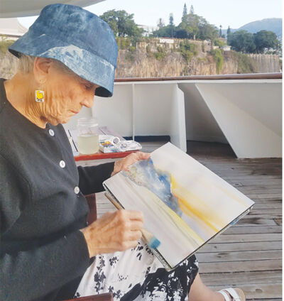  Carol LaChiusa paints outside during an art trip to France in 2019. 