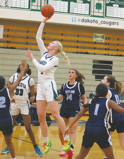  Macomb Dakota senior Gracie Maloney goes for a layup against Ann Arbor Skyline. 