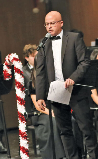  Matthew Diroff, Novi High School’s director of bands, leads his band students during the 2023 Christmas season. 