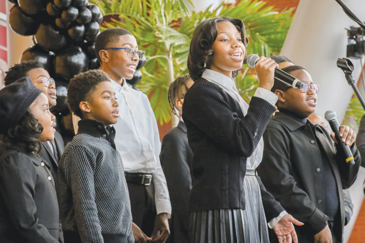 The Life Application Ministries Christian Church Youth Praise Team sings about love at the Martin Luther King Jr. Day Celebration with the theme  “Shifting the Climate — Focus on Love” on Jan. 15 at Warren City Hall. 