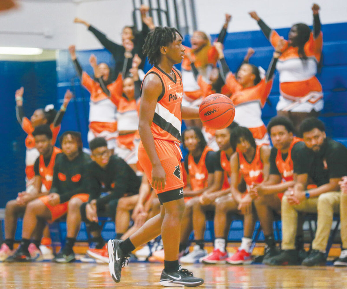  Center Line sophomore guard Kameren Broughton looks for an open teammate. 