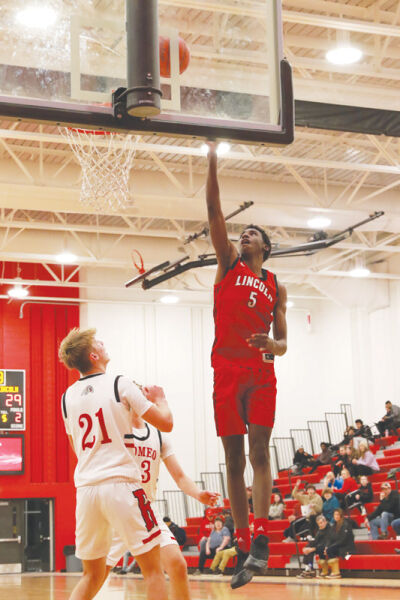  Warren Lincoln junior Chris Morgan puts up a shot during Lincoln’s 65-35  win over Romeo on Jan. 18 at  Romeo High School. 