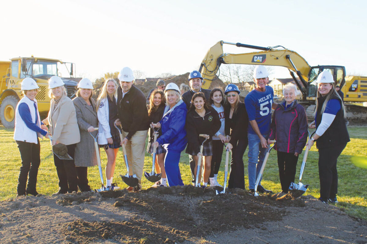  Construction continues on the Diane Laffey Athletic Field & Complex at Regina High School in Warren. The new complex, named after retired Athletic Director Laffey, second from right, will include a synthetic turf field, eight tennis courts, a track, bleachers, a press box, outdoor restrooms and concessions.  