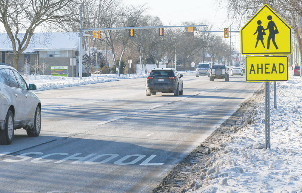  The crosswalk at 12 Mile Road and Edward Avenue would normally be used by students attending John Page Middle School in Madison Heights, but school was closed due to cold Jan. 17. Officials in Madison Heights want to study traffic in the city in order to improve motorist and pedestrian safety.  