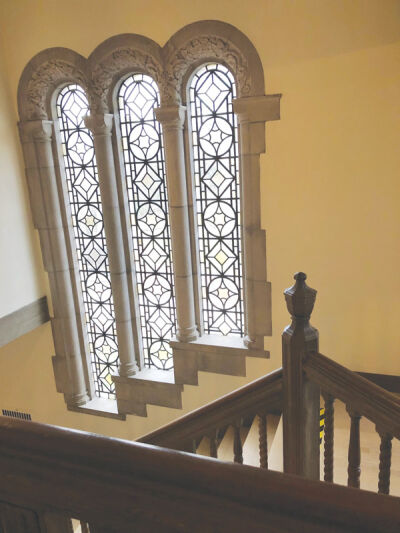  An intricately carved wooden staircase and beautiful windows are hallmarks of this 1929 Grosse Pointe City home. 