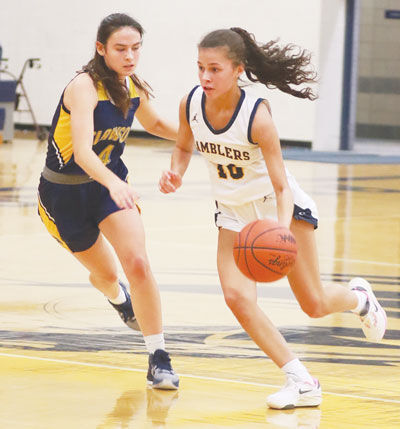  Fraser senior guard Jaida Oxendine drives past a Clawson defender during a matchup between the two schools on Jan. 16 at Fraser High School. 