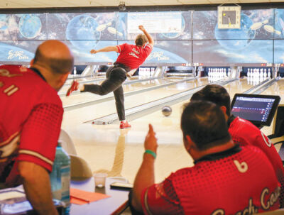 Chippewa Valley senior Dylan Gilbert rolls as Chippewa coaches look on.
