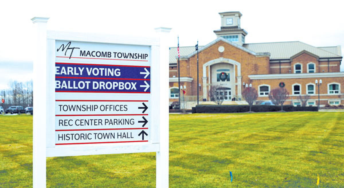  A sign directs visitors around the Macomb Township municipal complex, noting the locations of the ballot drop box and early voting site. At its meeting on Jan. 10, the Macomb Township Board of Trustees voted to have the sign and others like it installed. 