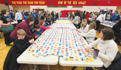  The Troy School District performed several chances for members of the community to pitch in and serve their community on Martin Luther King Day, including tying fleece blankets, pictured. 