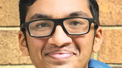  Ishaan Sid, a junior at Novi High School, shows the app he designed to win the Congressional App Challenge for the 6th District. 