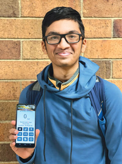  Ishaan Sid, a junior at Novi High School, shows the app he designed to win the Congressional App Challenge for the 6th District. 