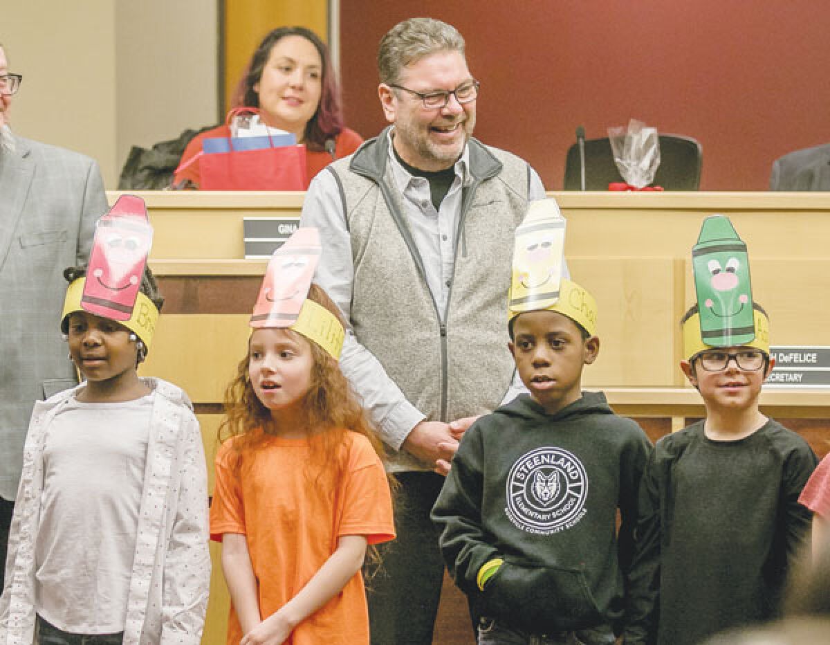 In 2023, Steenland Elementary School students honor school board Treasurer Matthew McCartney. 