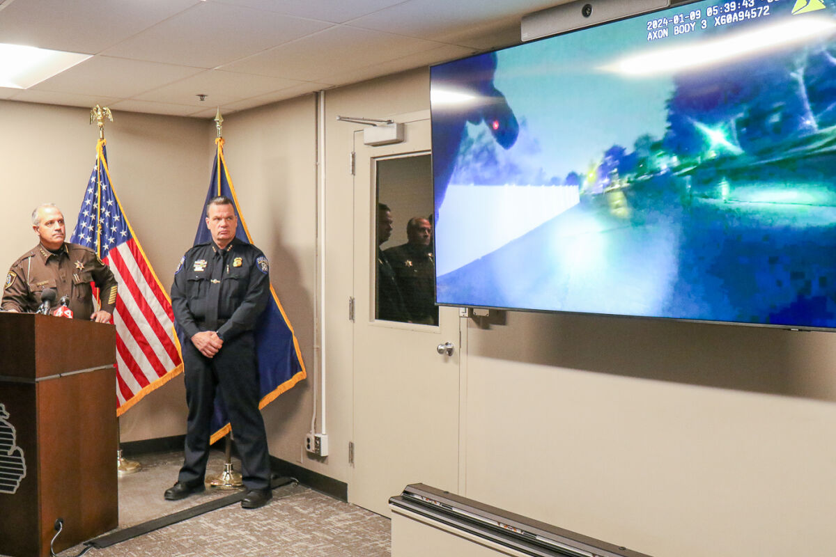  During a press conference Jan. 24, Macomb County Sheriff Anthony M. Wickersham, left, plays body camera footage from an officer involved shooting that occurred Jan. 9 in Shelby Township.  