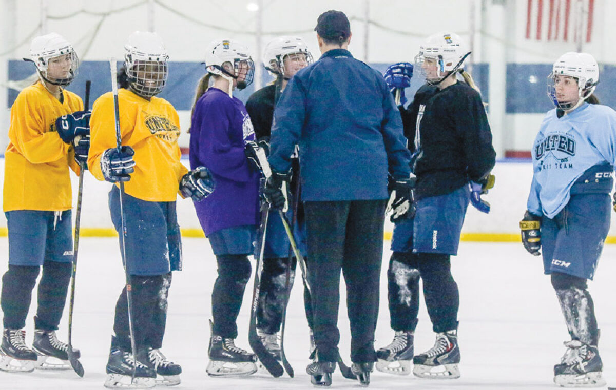  Regina-Lutheran North United head coach Paul Buscemi gathers the team during a team practice on Dec. 26 at Big Boy Arena. 