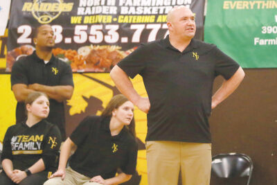  North Farmington first-year coach Michael Allan looks on during his team’s 47-32 win over Bloomfield Hills. 