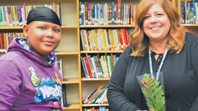  Roseville Middle School sixth grader Devin Perry, left, recognized Dort teacher Laura Sikorski. 