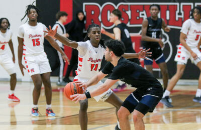  Roseville junior Kyle Reeves guards a Sterling Heights Stevenson player during Roseville’s 60-34 win over Stevenson Jan. 26 at Roseville High School. 