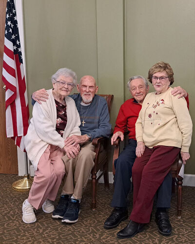  Sisters Joanne Arnold, 95, left, and Janice Randall, 89, sit with their U.S. military veteran husbands Roland Arnold, 97, and Dick Randall, 95, following a Veterans Day ceremony at Brookdale Senior Living of Novi last November.  
