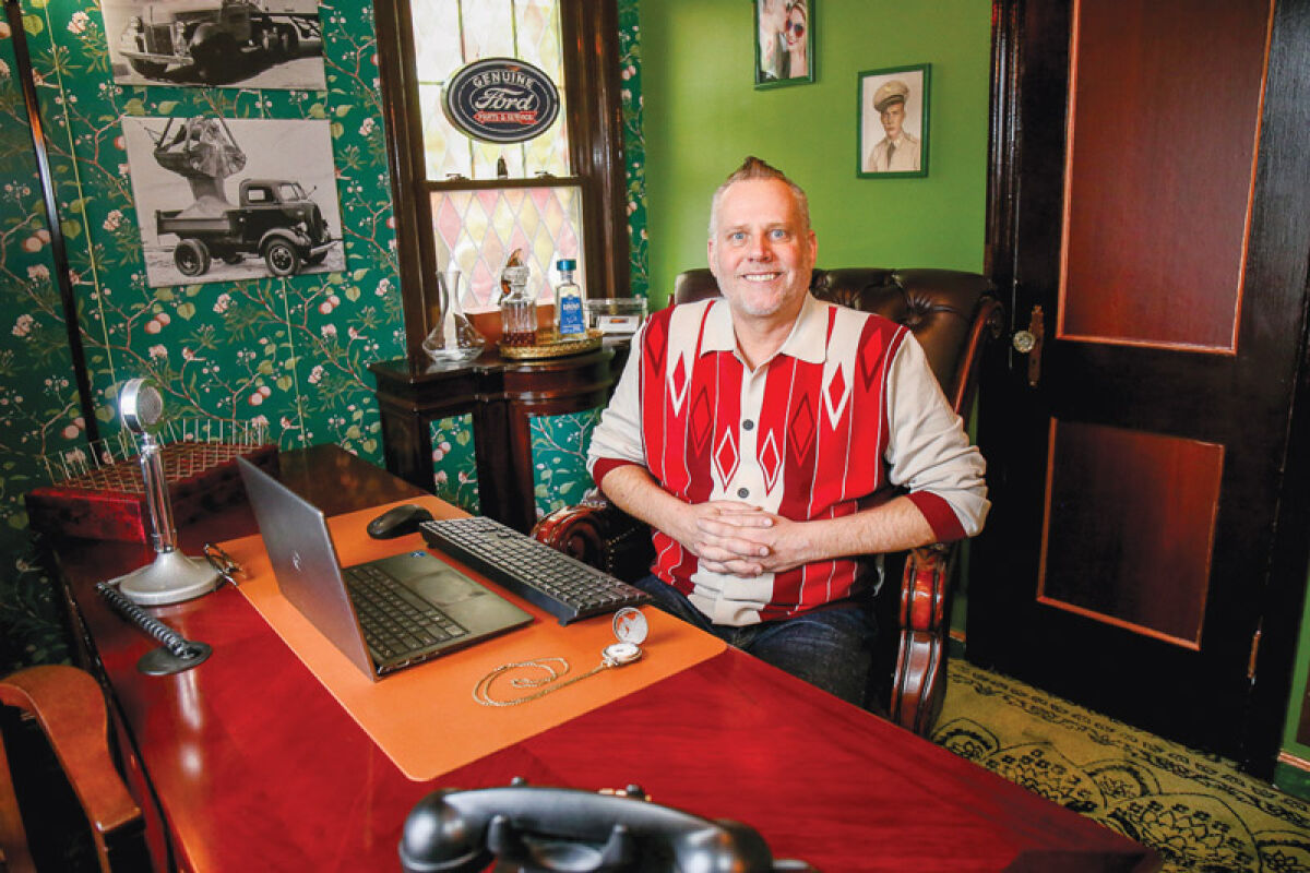  Tim Pearl sits in his office, which he decorated in the style of the 1920s and 1930s.  