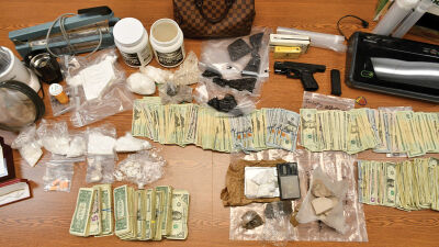  Drugs, related materials, cash and weapons were among the items seized by Warren police in a drug bust that netted three arrests.  