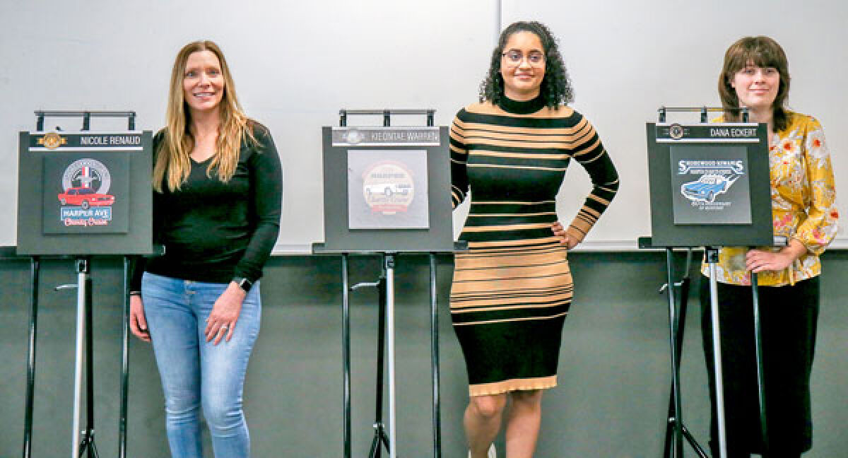  The three winners, Nicole Renaud (first place), Kieontae Warren (second place) and Dana Eckert (third place), stand by their winning designs, revealed on Feb. 9. 