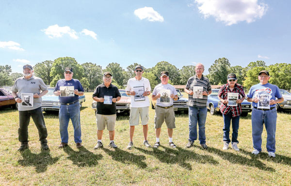  From left, veterans Don Kramer, of Mount Clemens; Art Meyer, of Clawson; Dave Zappa, of St. Clair Shores;  Walter “Don” Gilbert, of Shelby Township; David Hoffman, of Fort Gratiot; Gerald Horn, of Fraser; Michael O’Neil, of Roseville; and Rich Tweedle, of Clinton Township, stand with their classic cars and hold photographs from their military days at Kennedy Memorial Park in Eastpointe July 21. 