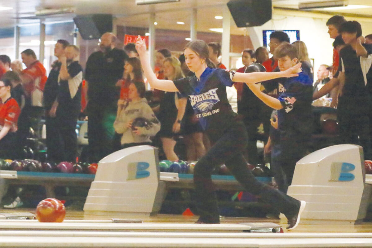  Utica Eisenhower junior Ava Ramales follows through on a roll as Eisenhower faces off against Macomb Area Conference Red rival Macomb Dakota Feb. 16 at Shelby Lanes. 
