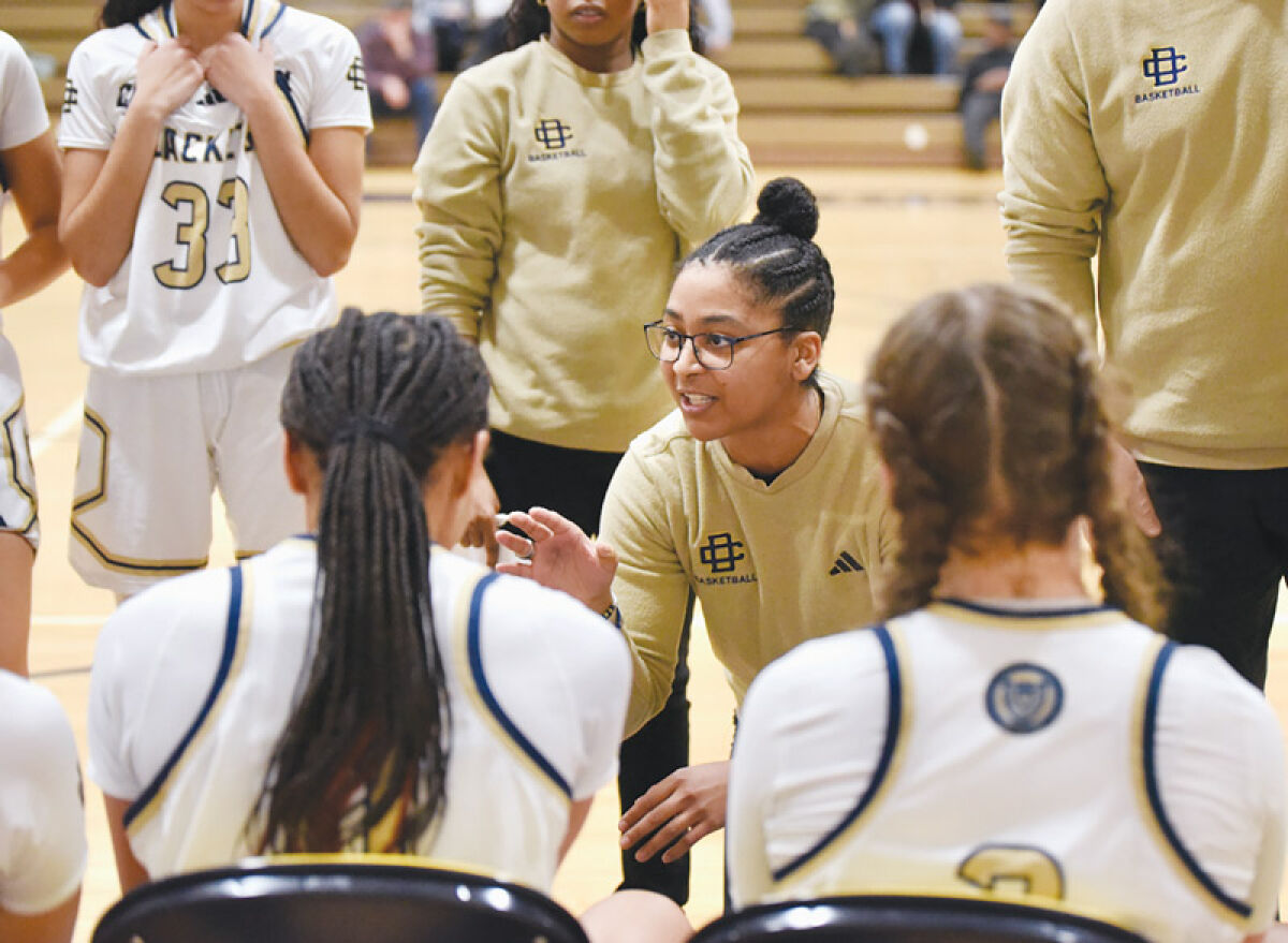  Detroit Country Day head coach Amber Deane talks to her team during their matchup against Ypsilanti Arbor Prep Feb. 15 at Country Day High School. 