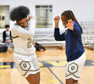 Country Day junior Ari’Yana Wiggins, left, and freshman Sanyiah Blackwell work on their dance moves. 