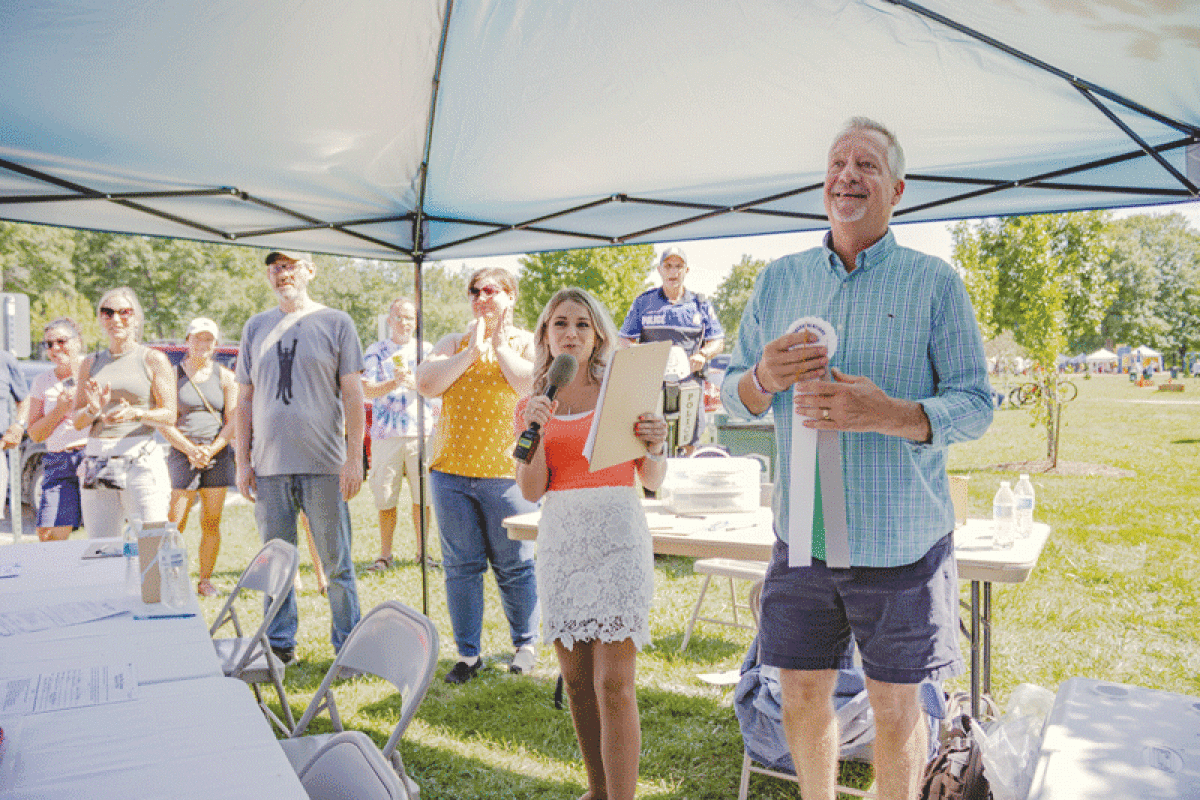  Taylor Vitany, host of “Living in Shelby Township,” announces the winners of the Better Pie baking contest with Shelby Township Treasurer James Carabelli at last year’s Shelby Township Art Fair. 