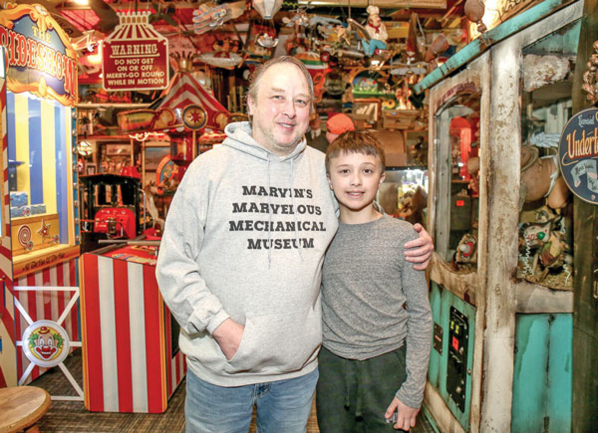  According to Marvin’s Marvelous Mechanical Museum owner Jeremy Yagoda, pictured with his son, Jonathan, more than 50,000 people have signed a petition in protest of a development that will likely force the business to move. 