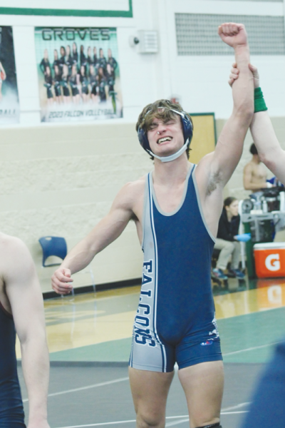  Senior Emmett Kenyon celebrates a win over a Berkley wrestler to advance to the finals in the 165-pound weight class at the Oakland County Championships meet Feb. 12 at Rochester High School. 