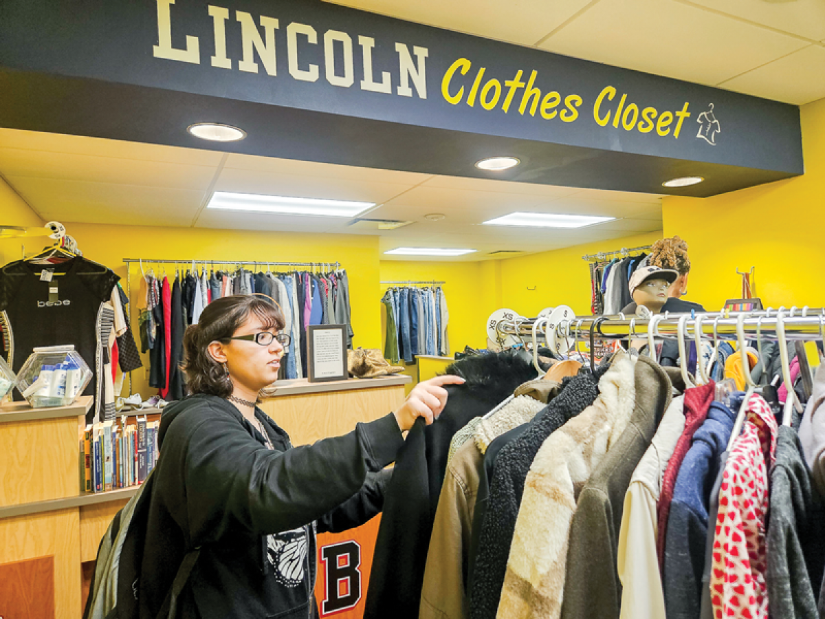  Lincoln High School junior Adelyna Cruz is one of the students who assists in the clothes closet. 