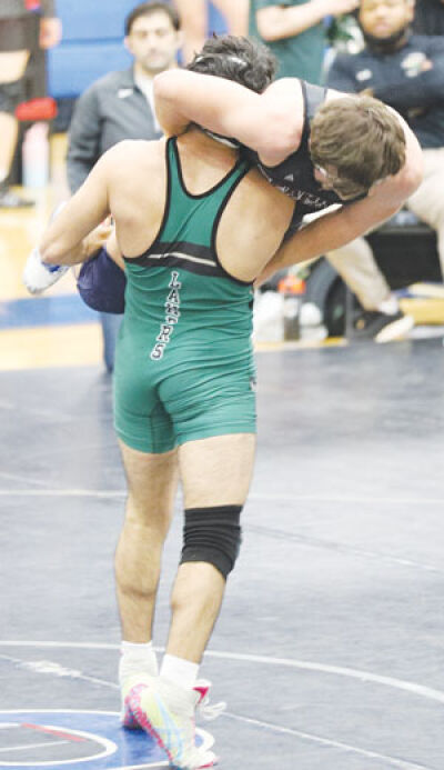  West Bloomfield junior Mohammad Hadeed carries his opponent during a match Jan. 10 at Royal Oak High School. 