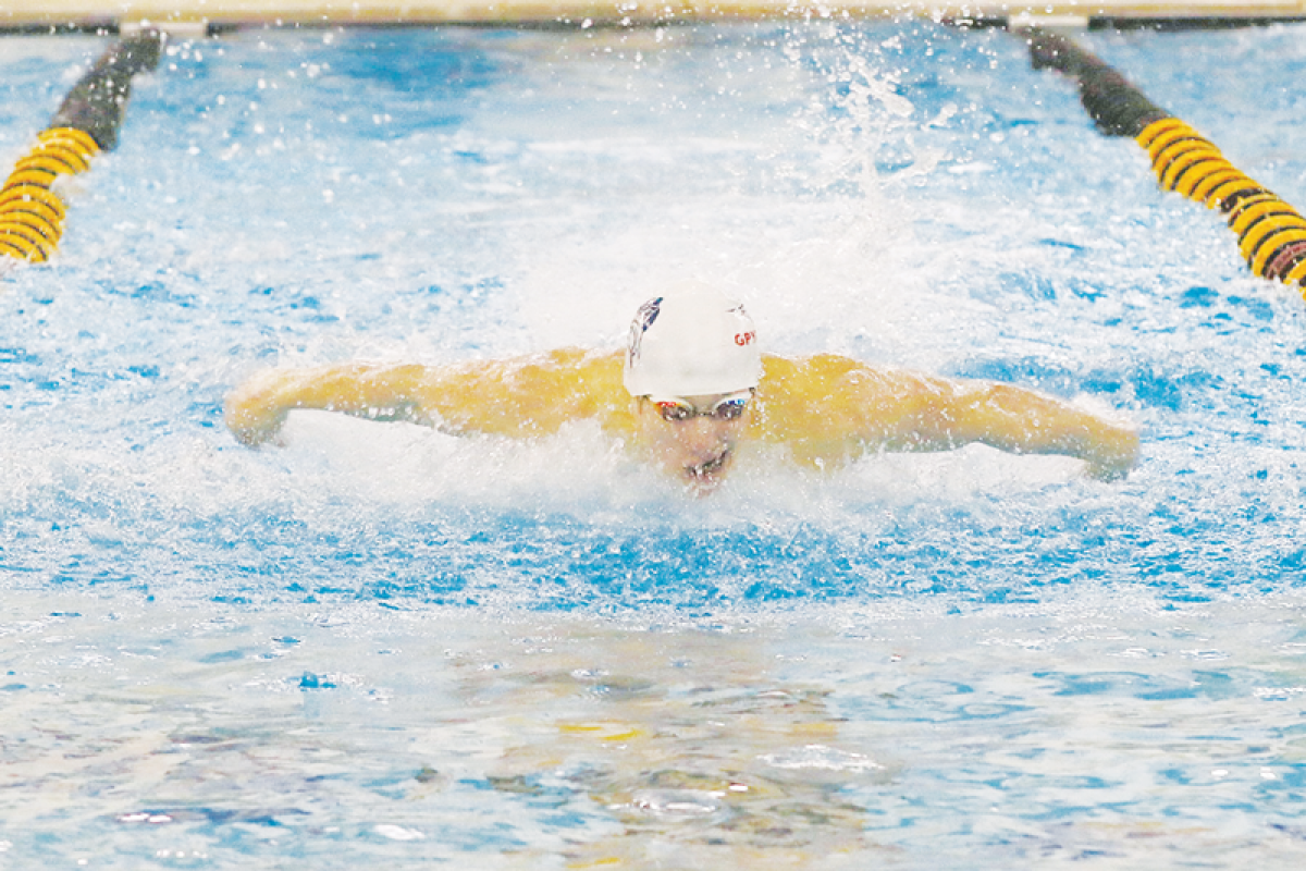  Utica Ford II junior Max Dexter competes in the 100 fly at the LCN Invitational Feb. 27 at  L’Anse Creuse North High School.  