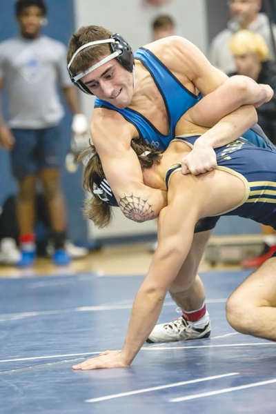  Warren Woods Tower senior Anthony Kazdaglis controls an opponent during a match.  