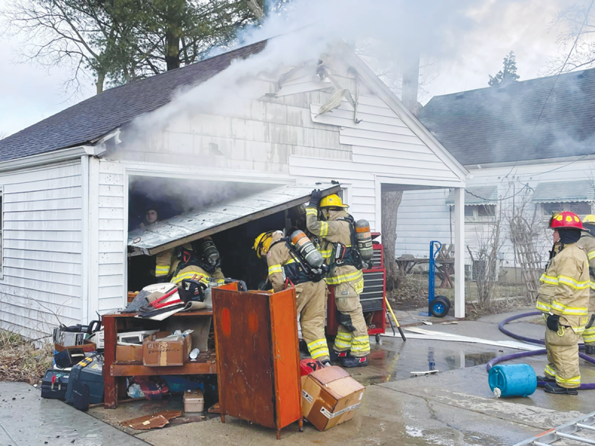  Firefighters work at the site of a garage fire in Berkley Feb. 28. 