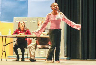  Lauren Miller rehearses a song for the musical.  