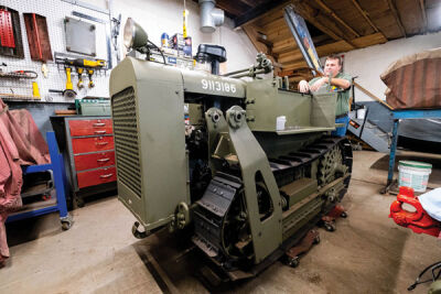  Chris Causley, the executive director of the Michigan Military Technical and Historical Society, talks about a 1944 Clark bulldozer that he’s in the process of restoring Aug. 3 in his St. Clair Shores home. 