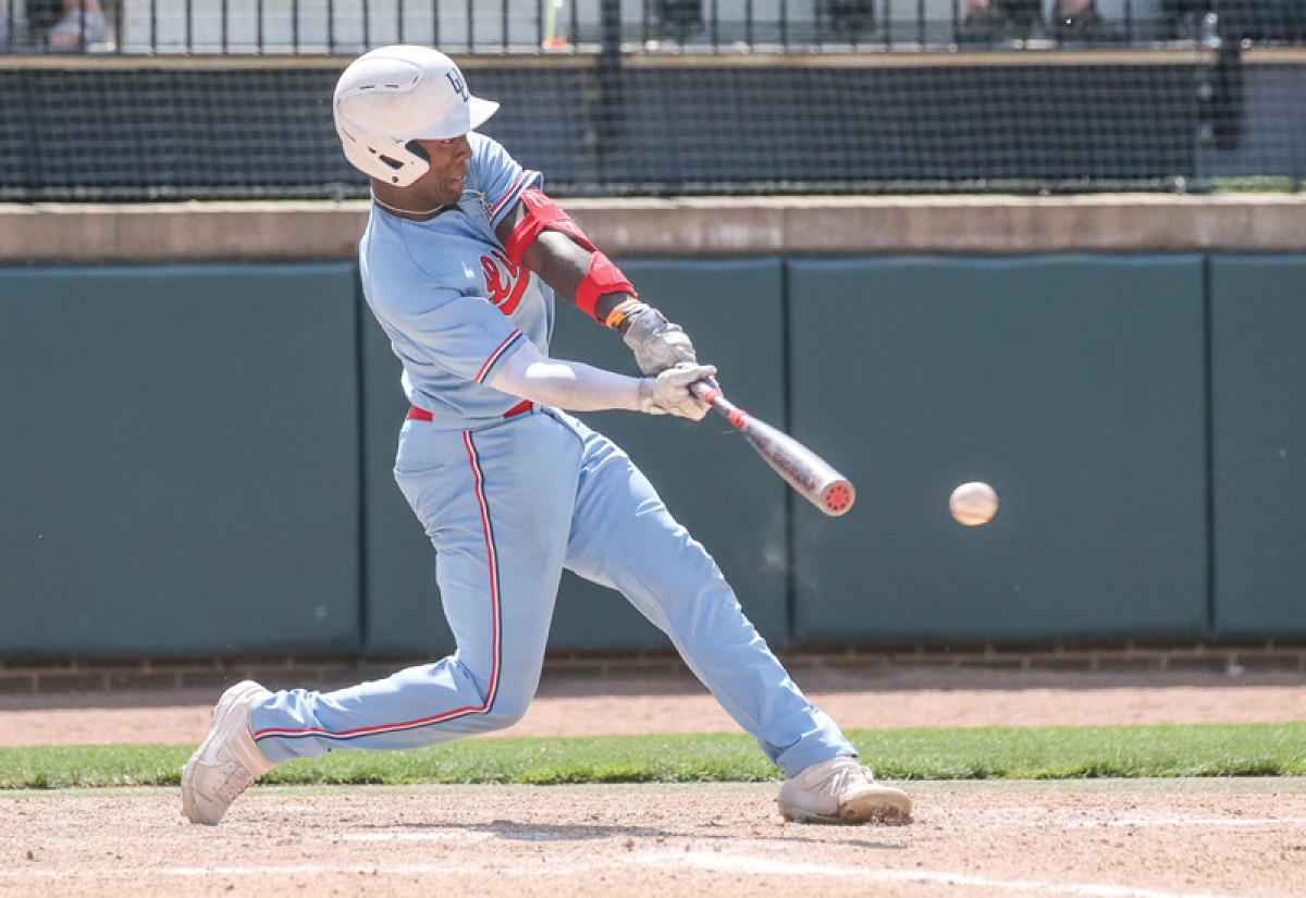  Grosse Pointe University Liggett graduate Oliver Service collects a base hit during the  MHSAA Division 2 state finals on June 17 at McLane Stadium at Michigan State University.  