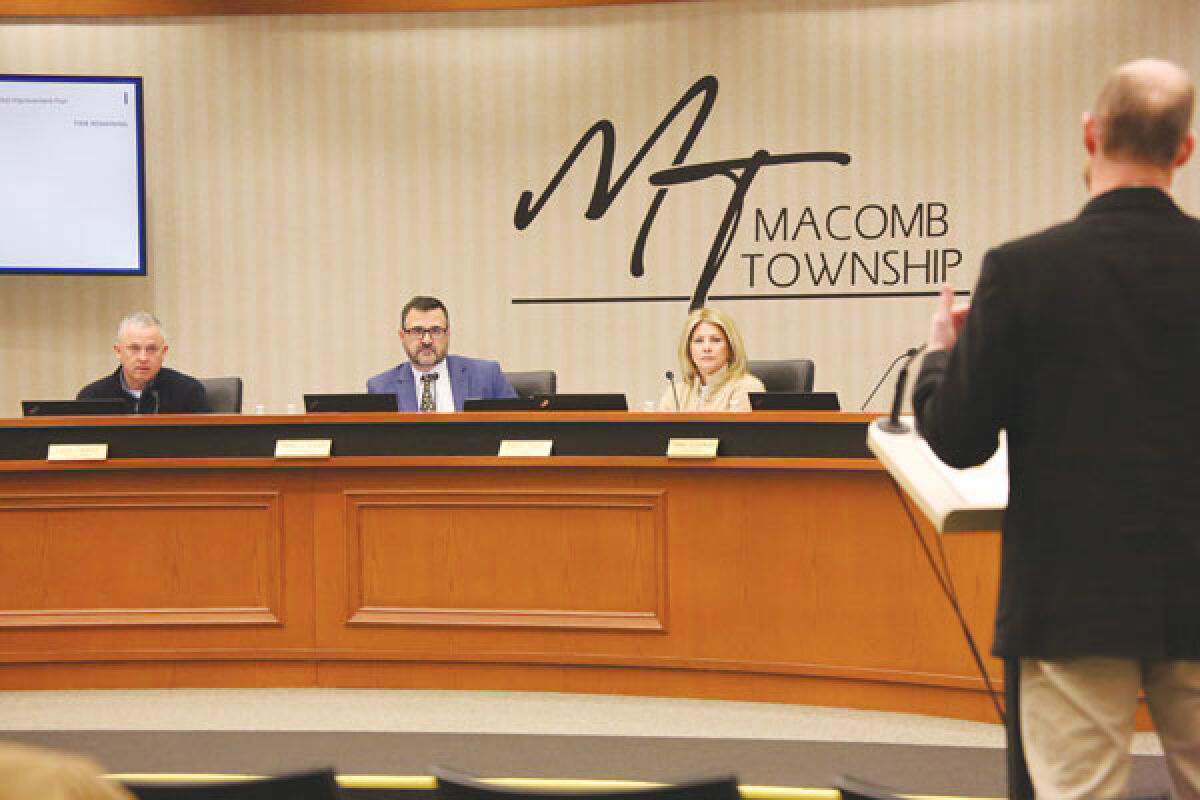  Macomb Township trustees listen to Department of Public Works Director Kevin Johnson as he discusses the five-year water and sewer capital improvement plan at the board’s Feb. 28 meeting. 