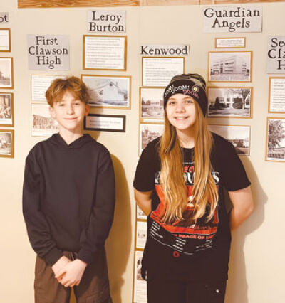  Owen Ball and Marlayna Reinhardt have fun digitizing newspaper clippings for the Clawson Historical Museum Feb. 24. 