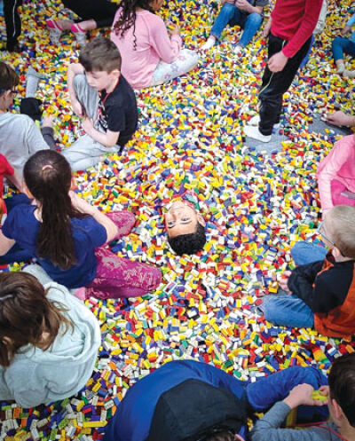  Kids play in the Brick Pit during the Brick Fest Live event held at the Suburban Collection Showplace in Novi March 2. 