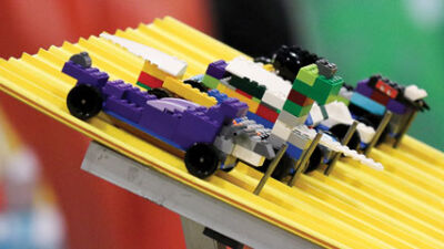  Lego derby cars made by attendees are ready to race. 