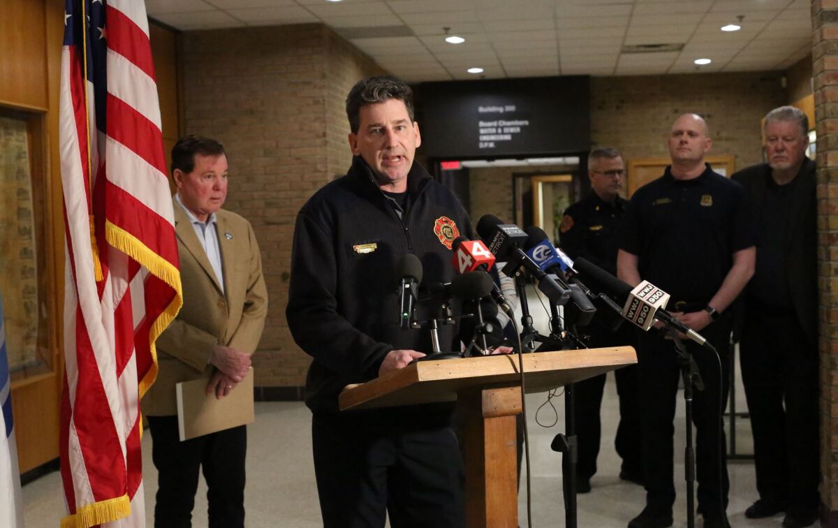  Fire Marshal Chuck Champagne of the Clinton Township Fire Department speaks to the press on March 8 at the Clinton Township Civic Center about the process and challenges facing investigators of the fire at Select Distributors.  