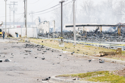   Debris litters the area near 15 Mile Road and Groesbeck Highway in Clinton Township on March 5, the morning after an explosive fire at Select Distributors.  