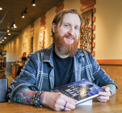  Author and Sterling Heights resident Steven Templar  holds his new novel, “Memoirs of a Lyrical Man.” 