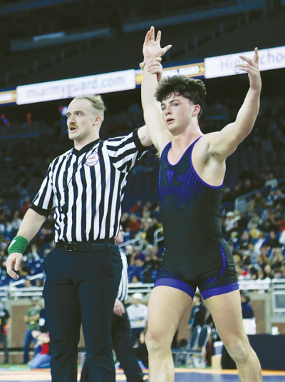 Utica Eisenhower senior Sam Agnello celebrates a win during the MHSAA individual wrestling state finals on March 2 at Ford Field. 