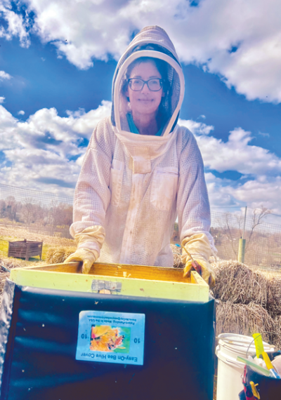  Apiarist Kerry Wysocki takes time out from tending her bees. Wysocki will make a presentation to the Shelby Gardeners Club at 1 p.m. April 11 at the Burgess-Shadbush Nature Center in Shelby Township. 