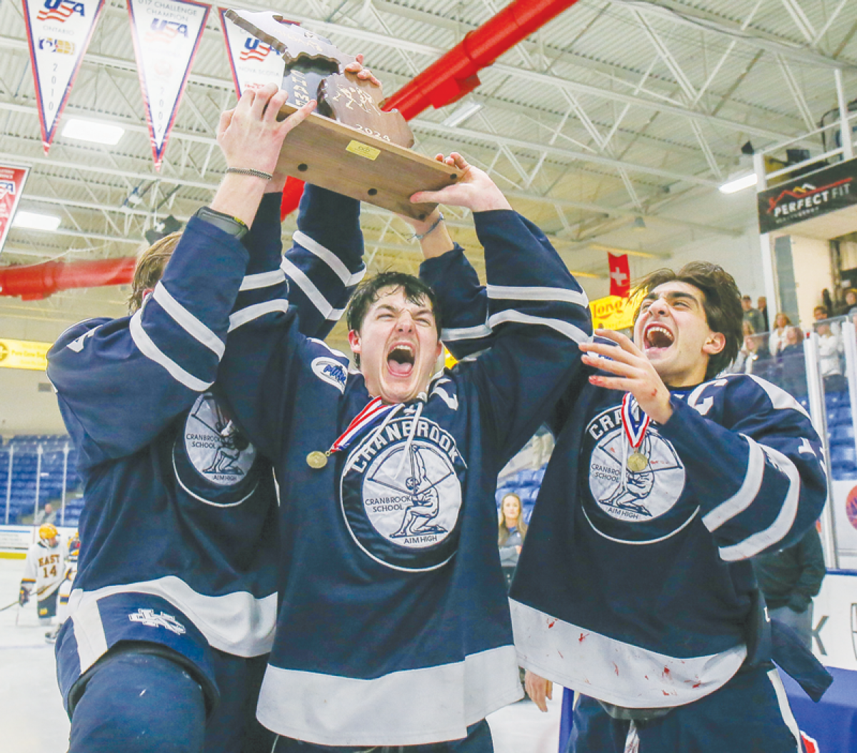  Bloomfield Hills Cranbrook Kingswood captains, from the left, Thomas Kiemel,Roman Cicco and Michael Horton accept the state championship trophy. 